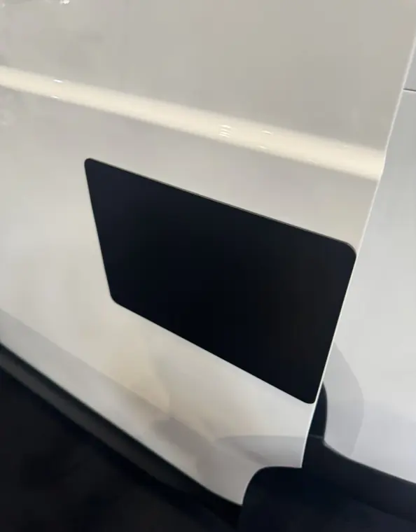 Large black security repair plate on a white van door