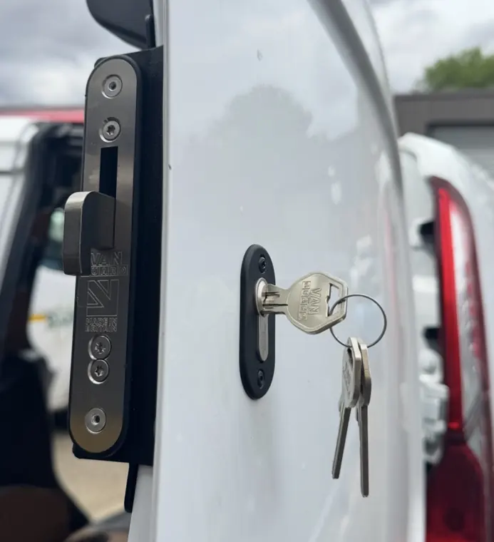 Van Guard hooklock installed on white van loading door