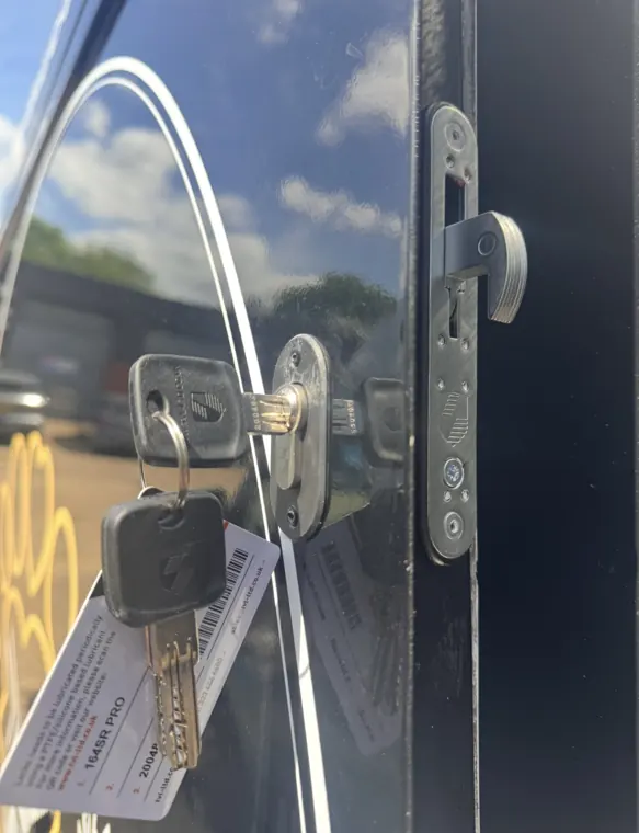 Hooklock with key on black van door
