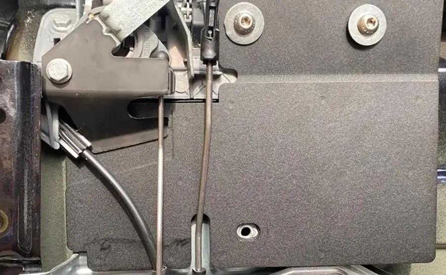 Internal shield fitted behind the door trim