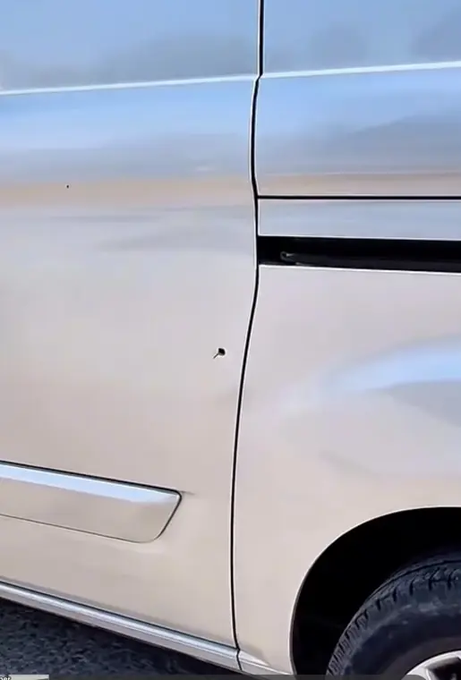 Damage visible on a silver van panel before fitting a repair plate