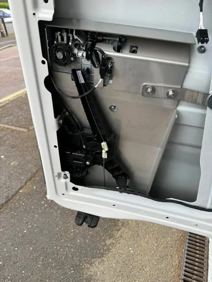 Large internal reinforcement panel fitted to van door